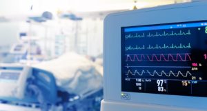 Image of a heart monitor in an ICU room