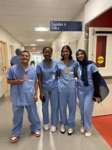 Amel Nurhussien and fellow students after shadowing a Neurosurgeon in the OR.