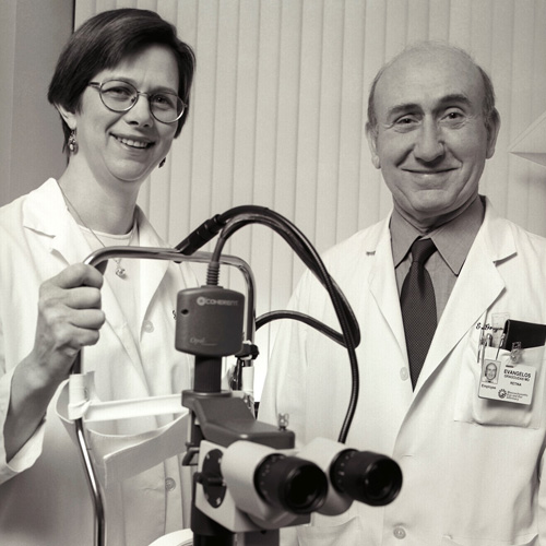 Joan W. Miller, MD, and Evangelos S. Gragoudas, MD, with the PDT laser used in clinical trials.